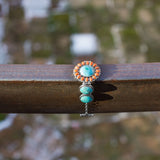 7.5" Reconstituted Turquoise and Coral Sunburst Toggle Bracelet