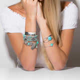 Set of 4 Silver Tone Multicharm Fashion Stretch Bracelets with Reconstituted Turquoise